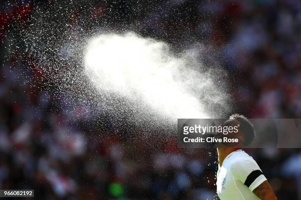 Kyle Walker of England spits water out prior to the International Friendly match between England and Nigeria at Wembley Stadium on June 2, 2018 in...