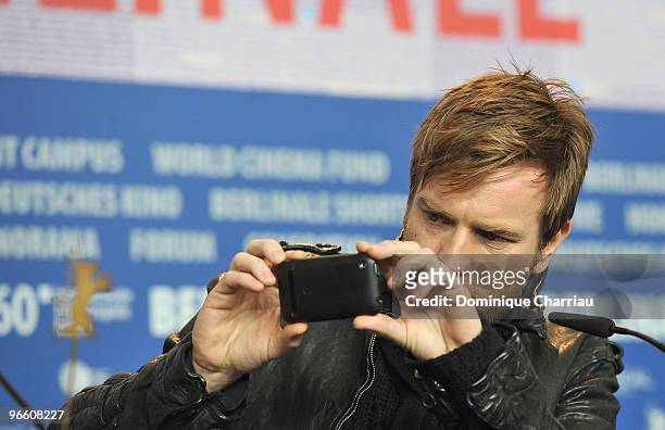 Actor Ewan McGregor takes a picture during the 'Ghost Writer' Press Conferencel during day two of the 60th Berlin International Film Festival at the...