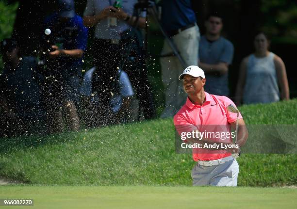 Tiger Woods of the United States hits his third shot on the first hole during the third round of The Memorial Tournament Presented by Nationwide at...