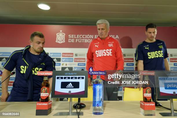 Switzerland's midfielder Xherdan Shaqiri , Switzerland's Bosnian-Herzegovinian coach Vladimir Petkovic and Switzerland's defender Fabian Schar attend...