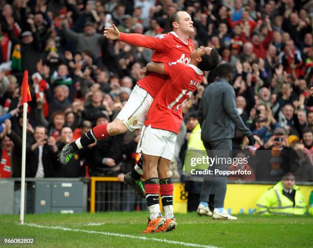Wayne Rooney of Manchester United celebrates with his team mate Nani after scoring a goal during the Barclays Premier League match between Manchester...
