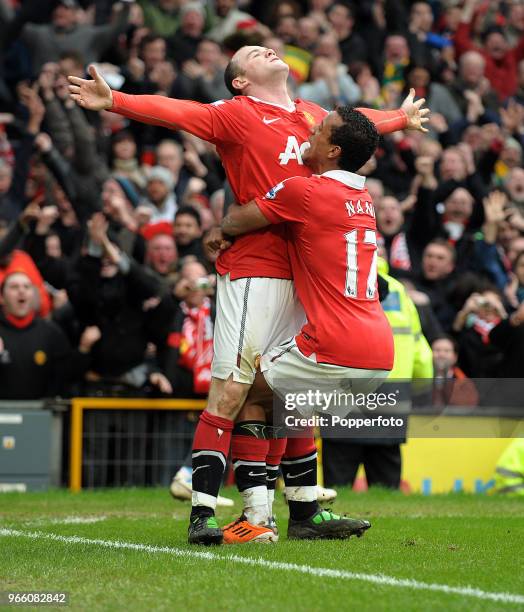 Wayne Rooney of Manchester United celebrates with his team mate Nani after scoring a goal during the Barclays Premier League match between Manchester...