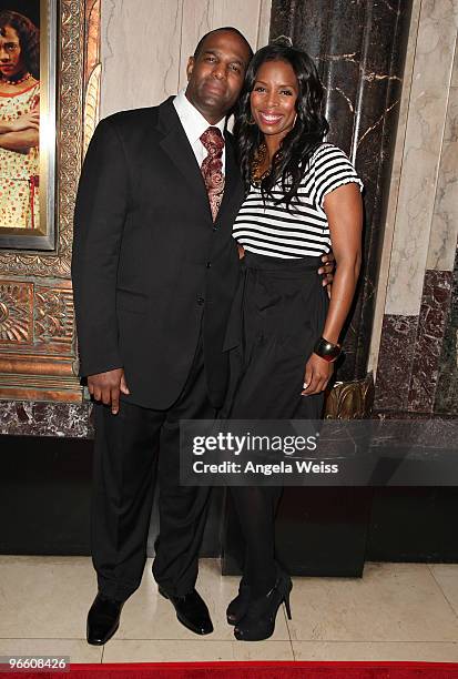 Actress Tasha Smith and guest attend the opening night of 'The Color Purple' at the Pantages Theatre on February 11, 2010 in Hollywood, California.