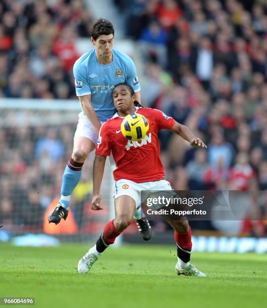 Anderson of Manchester United is challenged by Gareth Barry of Manchester City during the Barclays Premier League match between Manchester United and...