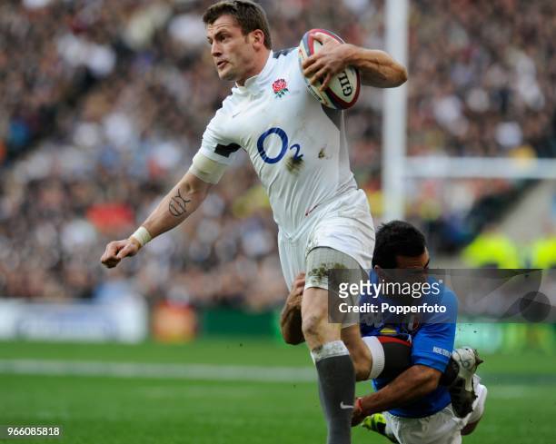 Mark Cueto of England is tackled during the RBS 6 Nations Championship match between England and Italy at Twickenham Stadium on February 12, 2011 in...