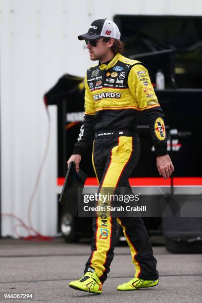 Ryan Blaney, driver of the Menards/Duracell Ford, walks through the garage area during practice for the Monster Energy NASCAR Cup Series Pocono 400...