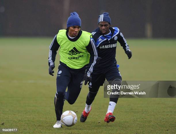 Florent Malouda and Gael Kakuta of Chelsea during a training session at the Cobham training ground on February 12, 2010 in Cobham, England.