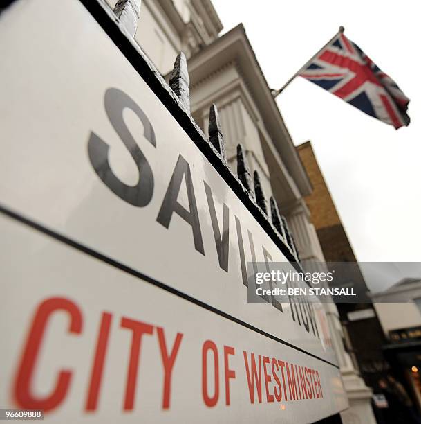 Union Jack flag flies above the door of Gieves and Hawkes tailors shop, where British Fashion designer Alexander McQueen worked before setting up his...