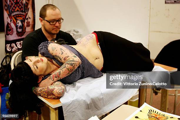 Woman gets tattooed during the 15th Milano Tattoo Convention held at Ata Hotel on February 12, 2009 in Milan, Italy.