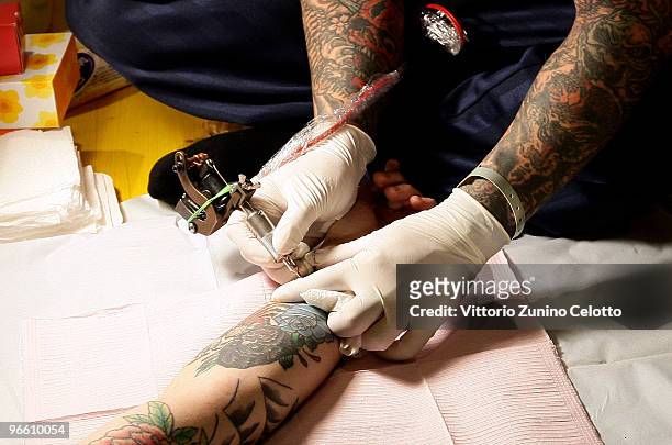 Man gets tattooed during the 15th Milano Tattoo Convention held at Ata Hotel on February 12, 2009 in Milan, Italy.