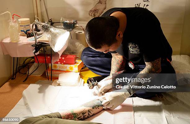 Man gets tattooed during the 15th Milano Tattoo Convention held at Ata Hotel on February 12, 2009 in Milan, Italy.