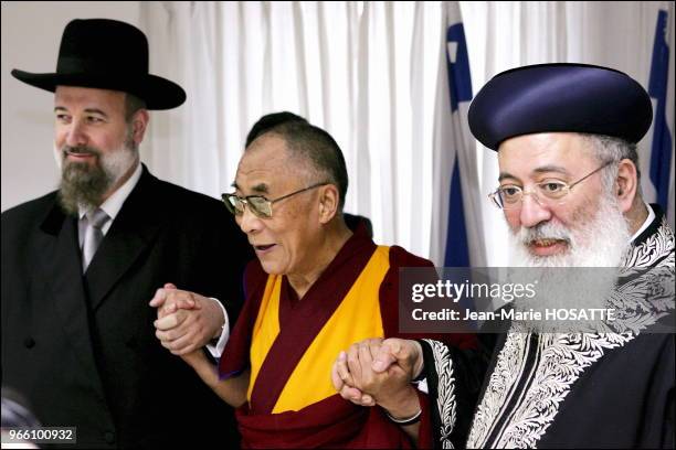 Tibetan spiritual leader, the Dalai Lama, shakes hands with Israel Chief Ashkenaki rabbi Yehuda Metzger , and Israeli chief Sephardic rabbi Shlomo...