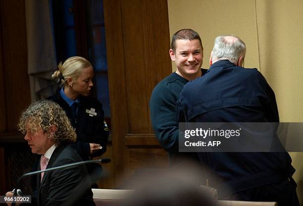 Defence counsel Bjoern Sandin and suspect Anders Hoegstroem attend a detention hearing in Stockholm city court on February 12, 2010. Hoegstroem was...