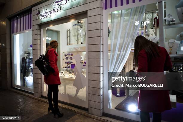 Fashionable girls in high heels shop at the Damascus Boulevard Mall.