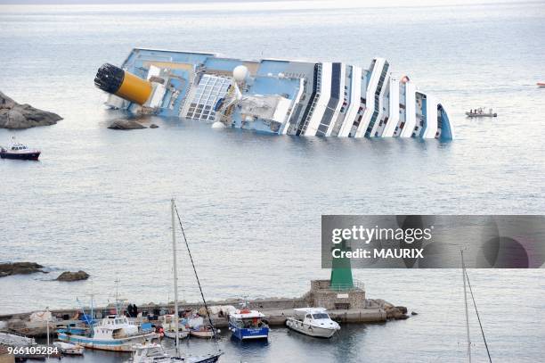 The cruise ship 'Costa Concordia' lies stricken off the shore of the island of Giglio, Italy on January 14, 2012. More than four thousand people were...