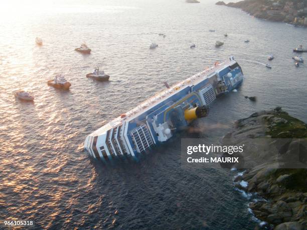 The cruise ship 'Costa Concordia' lies stricken off the shore of the island of Giglio, Italy on January 14, 2012. More than four thousand people were...