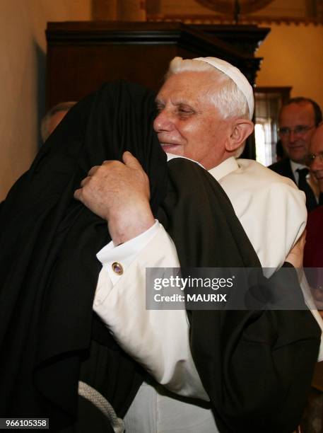 Pope Benedict XVI embraces a nun during a visit at the St. Chiara Basilica-Pastoral visit of pope Benedict XVI in Assisi, the city of Saint Francis....