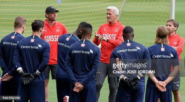 Switzerland's Bosnian-Herzegovinian coach Vladimir Petkovic speaks with players during a training session of Switzerlands's national football team at...