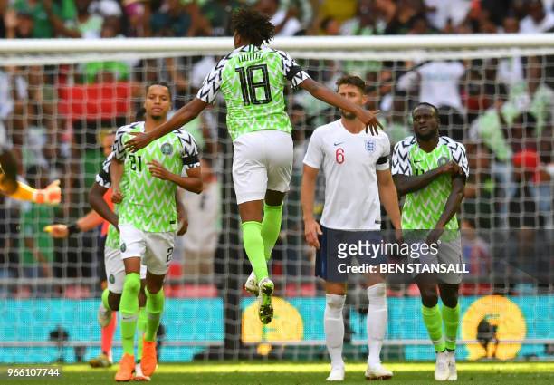 Nigeria's midfielder Alex Iwobi celebrates after scoring their first goal during the International friendly football match between England and...
