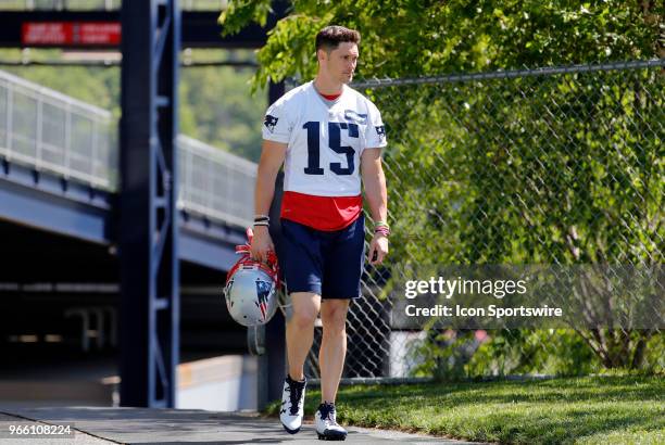 New England Patriots wide receiver Chris Hogan walks to the field during New England Patriots OTA on May 31 at the Patriots Practice Facility in...