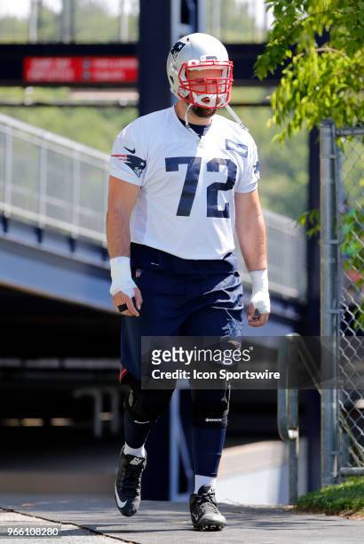 New England Patriots offensive lineman Luke Bowanko walks to the field during New England Patriots OTA on May 31 at the Patriots Practice Facility in...