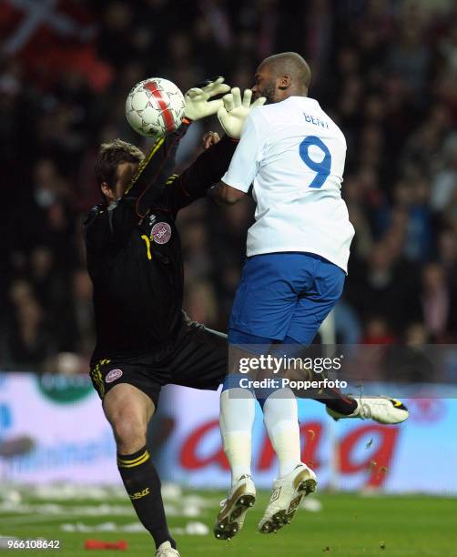 Denmark goalkeeper Thomas Sorensen of Denmark clashes with Darren Bent of England during the international friendly match between Denmark and England...