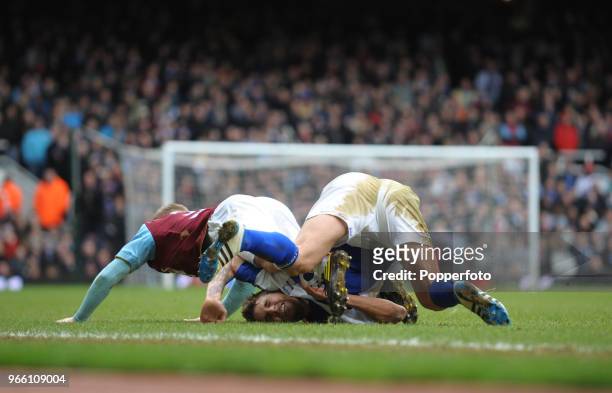 David Bentley of Birmingham City falls awkwardly during the Barclays Premier League match between West Ham United and Birmingham City at Upton Park...