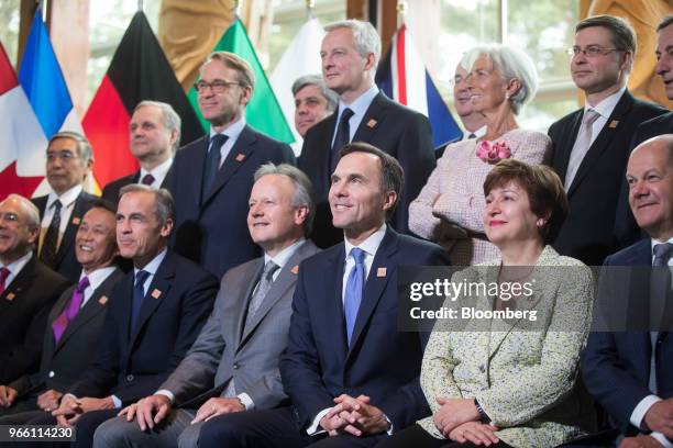 Ministers and delegates including Taro Aso, Japan's finance minister, from front left, and Mark Carney, governor of the Bank of England , Stephen...