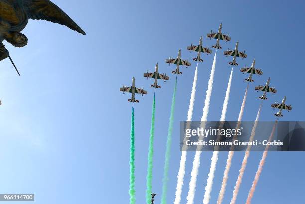 The Italian Special Air Force aerobatic unit 'Frecce Tricolori' spreads smoke with the colors of the Italian flag over the city of Rome during the...