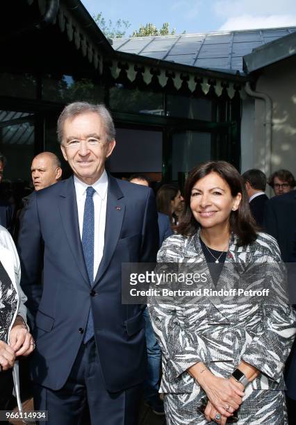 Owner of LVMH Luxury Group Bernard Arnault and Mayor of Paris Anne Hidalgo attend the Inauguration of the new "Jardin D'Acclimatation" on June 2,...