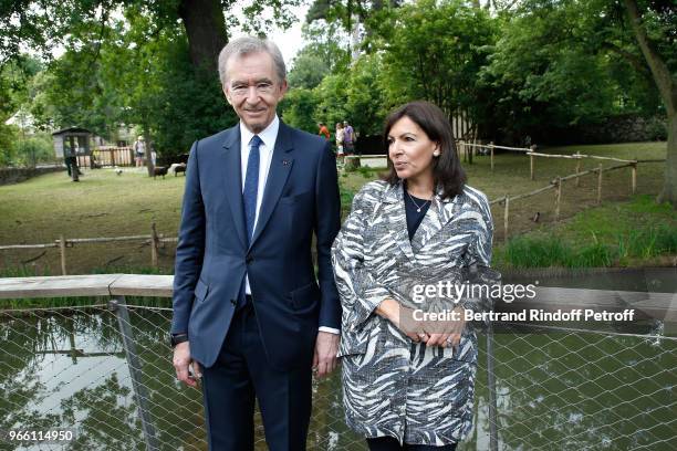Owner of LVMH Luxury Group Bernard Arnault and Mayor of Paris Anne Hidalgo attend the Inauguration of the new "Jardin D'Acclimatation" on June 2,...