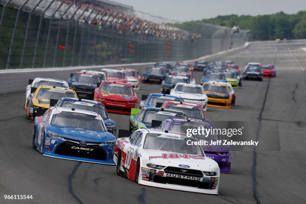 Cole Custer, driver of the Haas Automation Ford, Ryan Truex, driver of the Phantom Fireworks Chevrolet, and Kyle Busch, driver of the Comcast Salute...