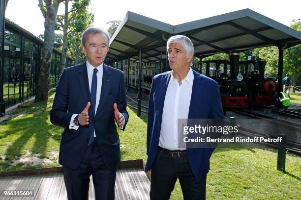 Owner of LVMH Luxury Group Bernard Arnault and General manager of LVMH Antonio Belloni attend the Inauguration of the new "Jardin D'Acclimatation" on...