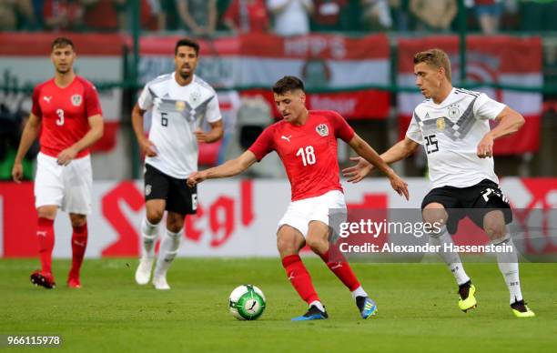 Alessandro Schoepf of Austria and Nils Petersen of Germany battle for the ball during the International Friendly match between Austria and Germany at...