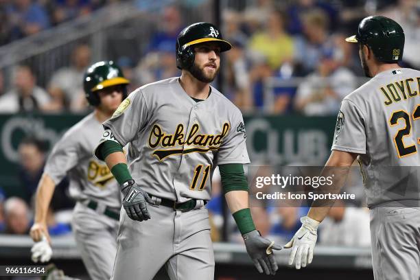 Oakland Athletics left fielder Matt Joyce greets Oakland Athletics center fielder Dustin Fowler after he hit a three-run home run in the ninth inning...