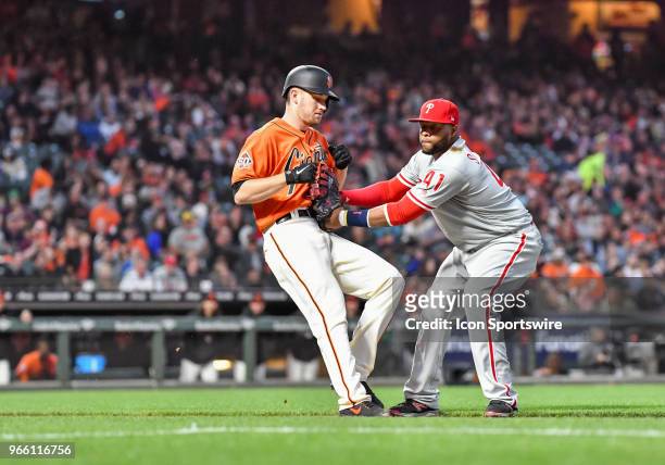 Philadelphia Phillies First base Carlos Santana tags out San Francisco Giants Pitcher Chris Stratton during the Philadelphia Phillies and the San...