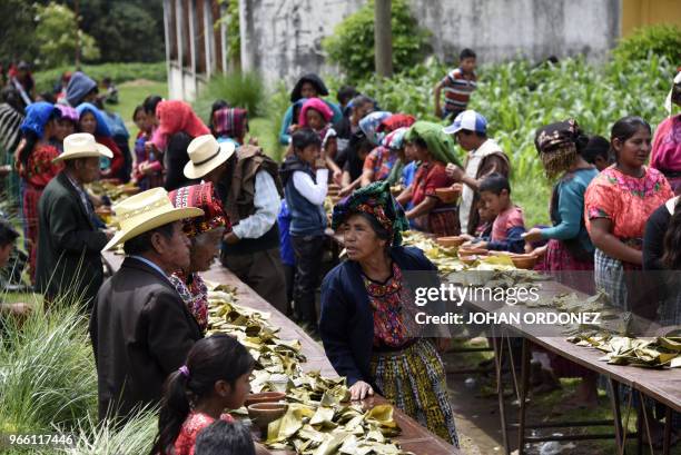 Indigenous people eat before the burial of Claudia Gomez, a 19-year-old Guatemalan woman who was allegedly shot and killed by a U.S. Border patrol...