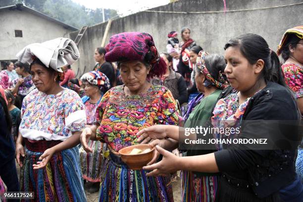 Indigenous people eat before the burial of Claudia Gomez, a 19-year-old Guatemalan woman who was allegedly shot and killed by a U.S. Border patrol...