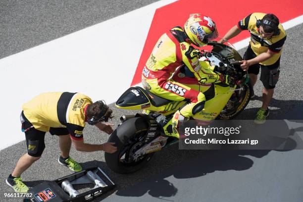 The mechanics of B Dominique Aegerter of Swiss and Kiefer Racing at work on the bike in pit during the qualifying practice during the MotoGp of Italy...