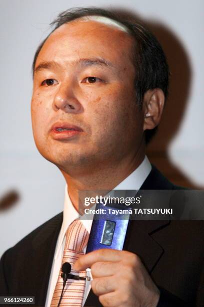 The billionaire founder and President of Softbank Corp. Masayoshi Son unveils a new line-up of cellphone models in Tokyo September 28, 2006....