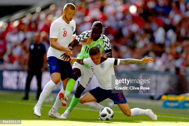 Victor Moses of Nigeria in action with Eric Dier and Kieran Trippier of England during an International Friendly between England and Nigeria at...