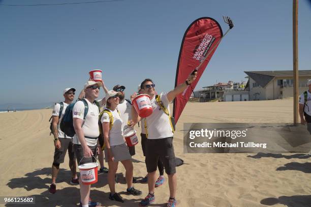 Veterans preparing to participate in Walking With The Wounded's Walk Of America take a selfie at Dockweiler Youth Center on June 2, 2018 in Playa del...