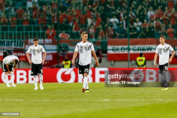 Sebastian Rudy, Nils Petersen and Mesut Oezil of Germany looks on during the international friendly match between Austria and Germany at Woerthersee...