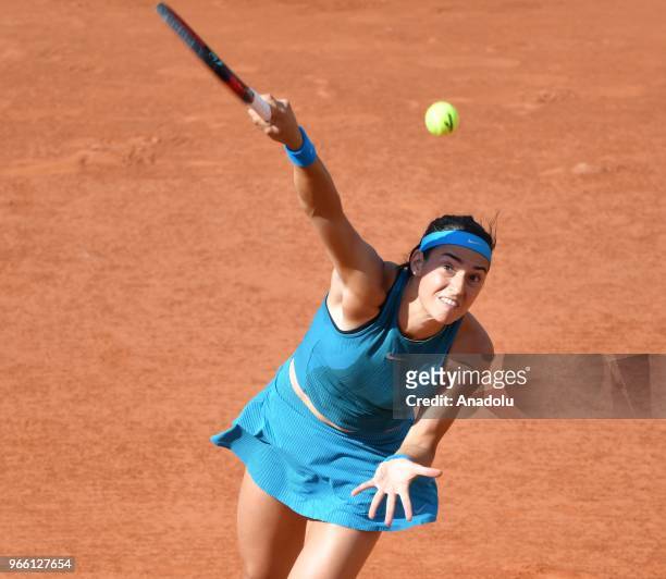 Caroline Garcia of France in action against Irina-Camelia Begu of Romania during their third round match at the French Open tennis tournament at...