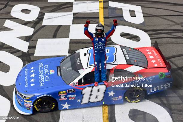 Kyle Busch, driver of the Comcast Salute to Service/Juniper Toyota, celebrates after winning the NASCAR Xfinity Series Pocono Green 250 Recycled by...