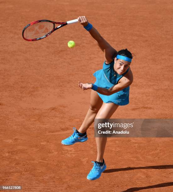 Caroline Garcia of France in action against Irina-Camelia Begu of Romania during their third round match at the French Open tennis tournament at...