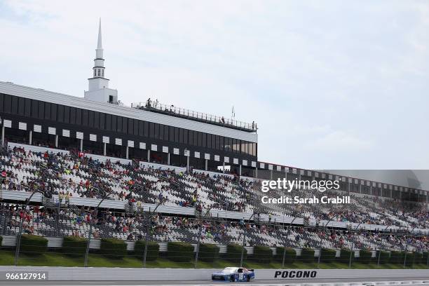 Kyle Busch, driver of the Comcast Salute to Service/Juniper Toyota, races during the NASCAR Xfinity Series Pocono Green 250 Recycled by J.P. Mascaro...