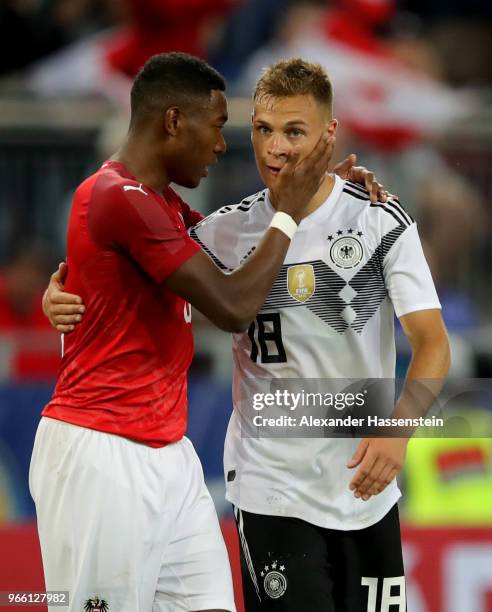 David Alaba of Austria comforts Joshua Kimmich of Germany after the International Friendly match between Austria and Germany at Woerthersee Stadion...