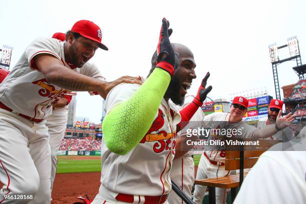 Marcell Ozuna of the St. Louis Cardinals is congratulated by Jose Martinez of the St. Louis Cardinals after hitting a home run against the Pittsburgh...