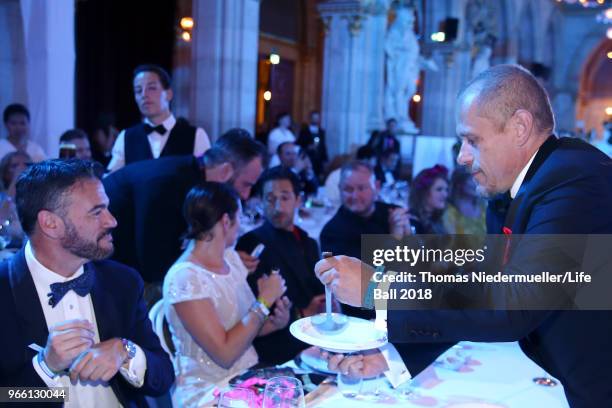 Gery Keszler is seen serving his guests soup at the LIFE+ Solidarity Gala prior to the Life Ball at City Hall on June 2, 2018 in Vienna, Austria. The...